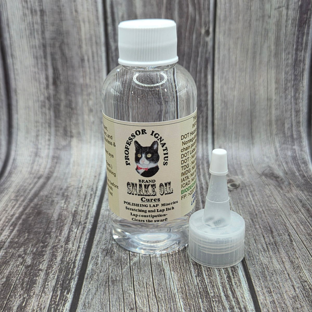 Bottle of Professor Ignatius Brand Snake Oil™ with separate applicator nozzle