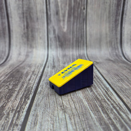 Yellow and navy BATTSTIK™ Sharpener shown from the front and side