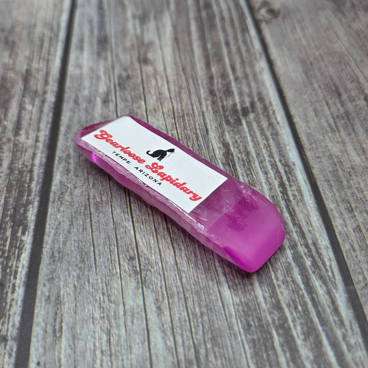 Pink corundum Boule Tool™ with Gearloose Lapidary label