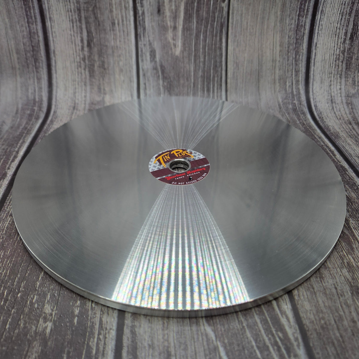 TIN PLUS™ laminated tin-alloy faceting lap shown at an angle, with its polishing surface and edge visible